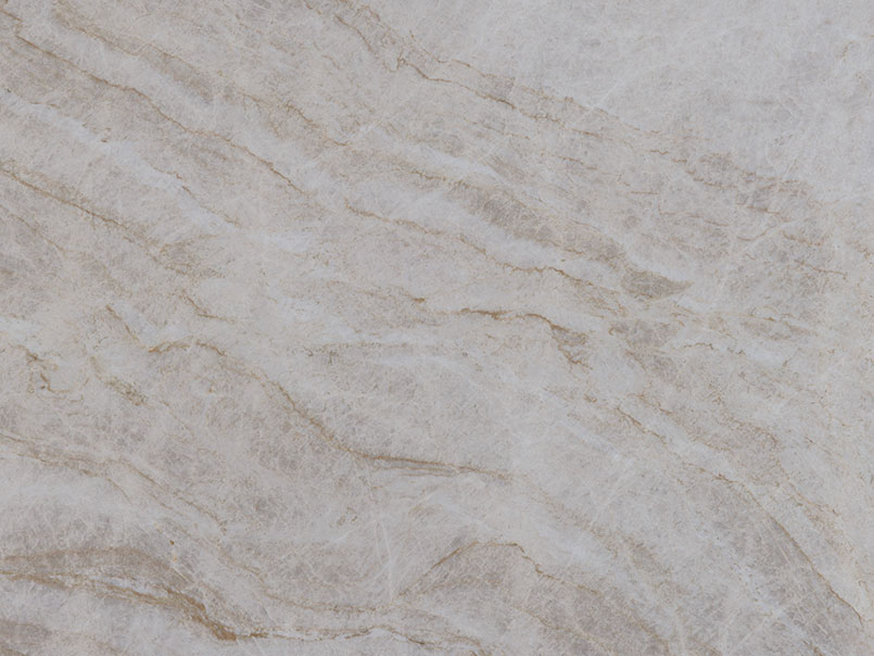 Close up detail of natural quartzite slab veining and crystalline structure for custom kitchen fabrication